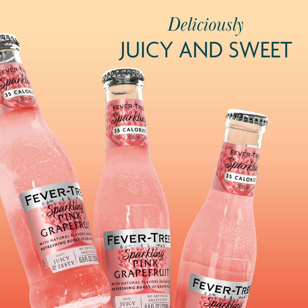 Bubbles rising in Fever-Tree Sparkling Pink Grapefruit in a glass.