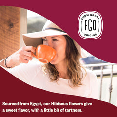 FGO Organic hibiscus infusion in glass, deep ruby-red color