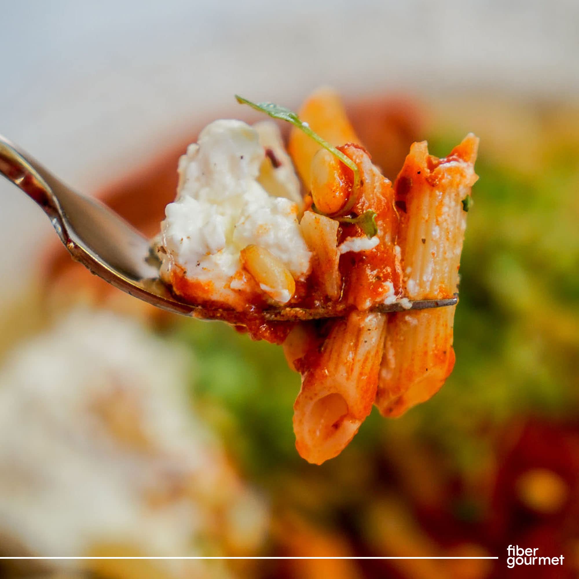 Family dinner scene with Fiber Gourmet Light Penne as a healthy pasta option.