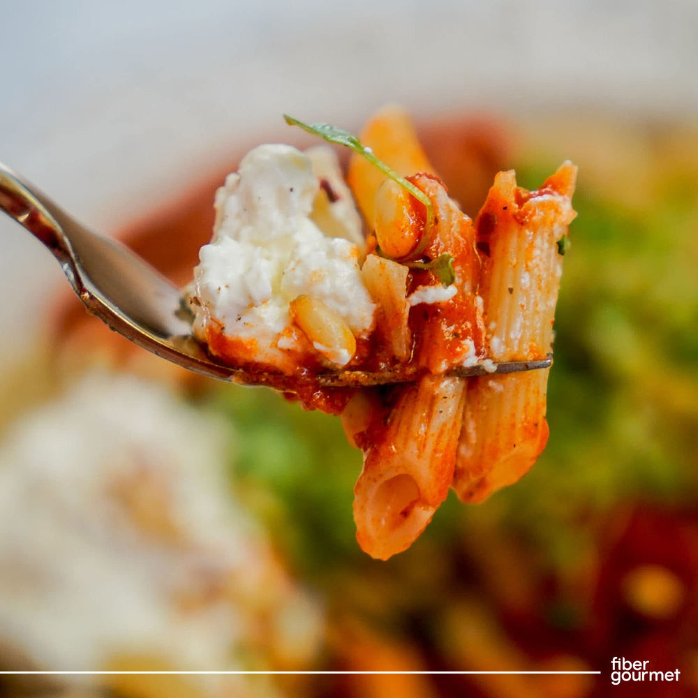 Family dinner scene with Fiber Gourmet Light Penne as a healthy pasta option.