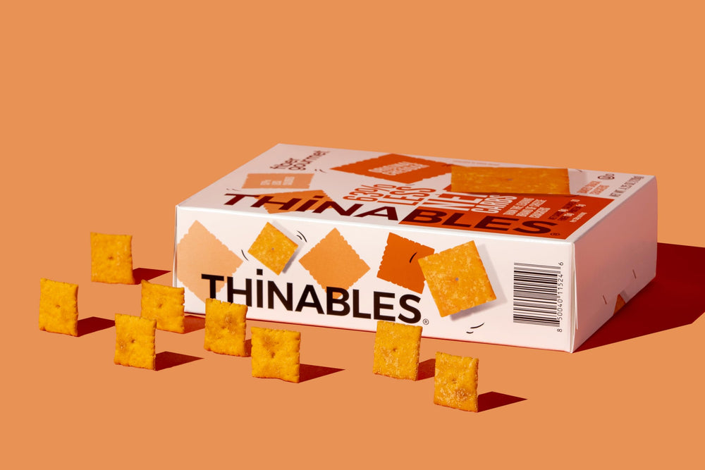 Serving idea with cheese and olives featuring Fiber Gourmet Thinables crackers