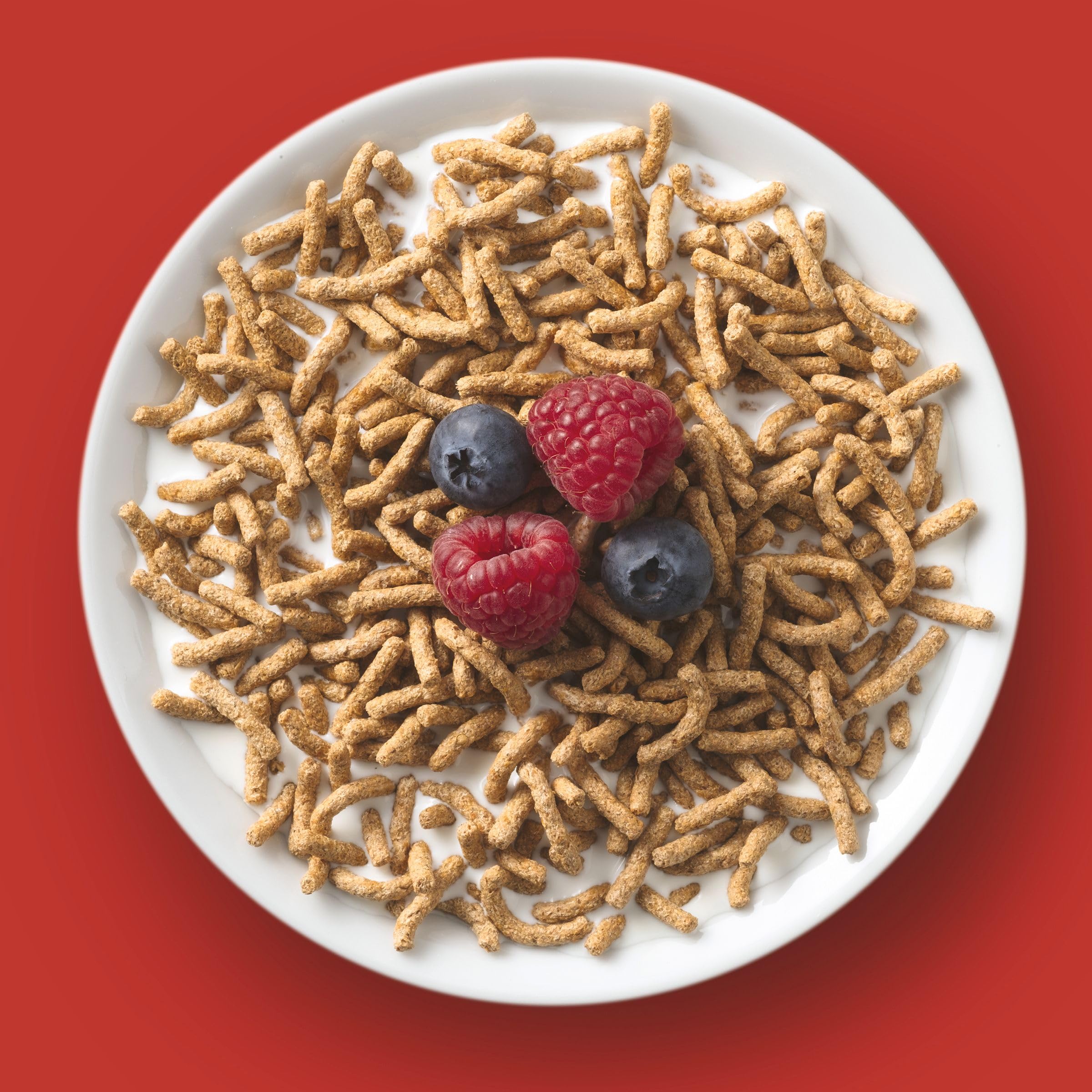 Pouring Fiber One Original Bran to start the day with a fiber boost.