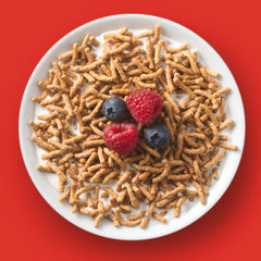 Pouring Fiber One Original Bran to start the day with a fiber boost.