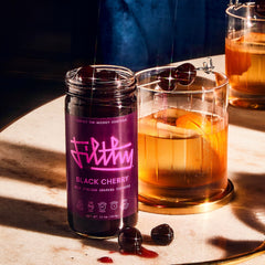 Filthy Food Italian Amarena cherries copper pot, slow-cooked depth for sophisticated drinks.