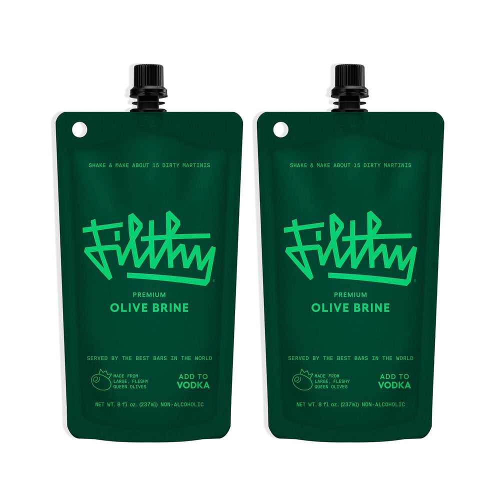 Filthy Food olive brine bottle pour showing bar-quality martini base