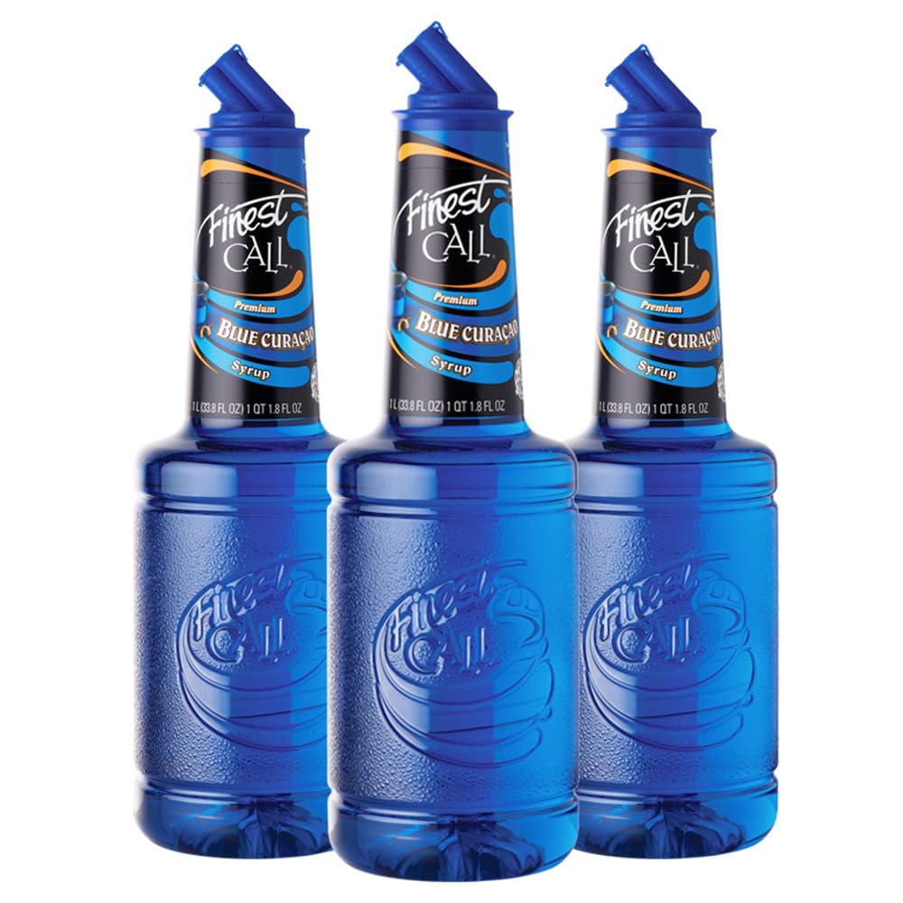 Finest Call Blue Curaçao bottle highlights a premium non-alcoholic mixer for tropical cocktails.