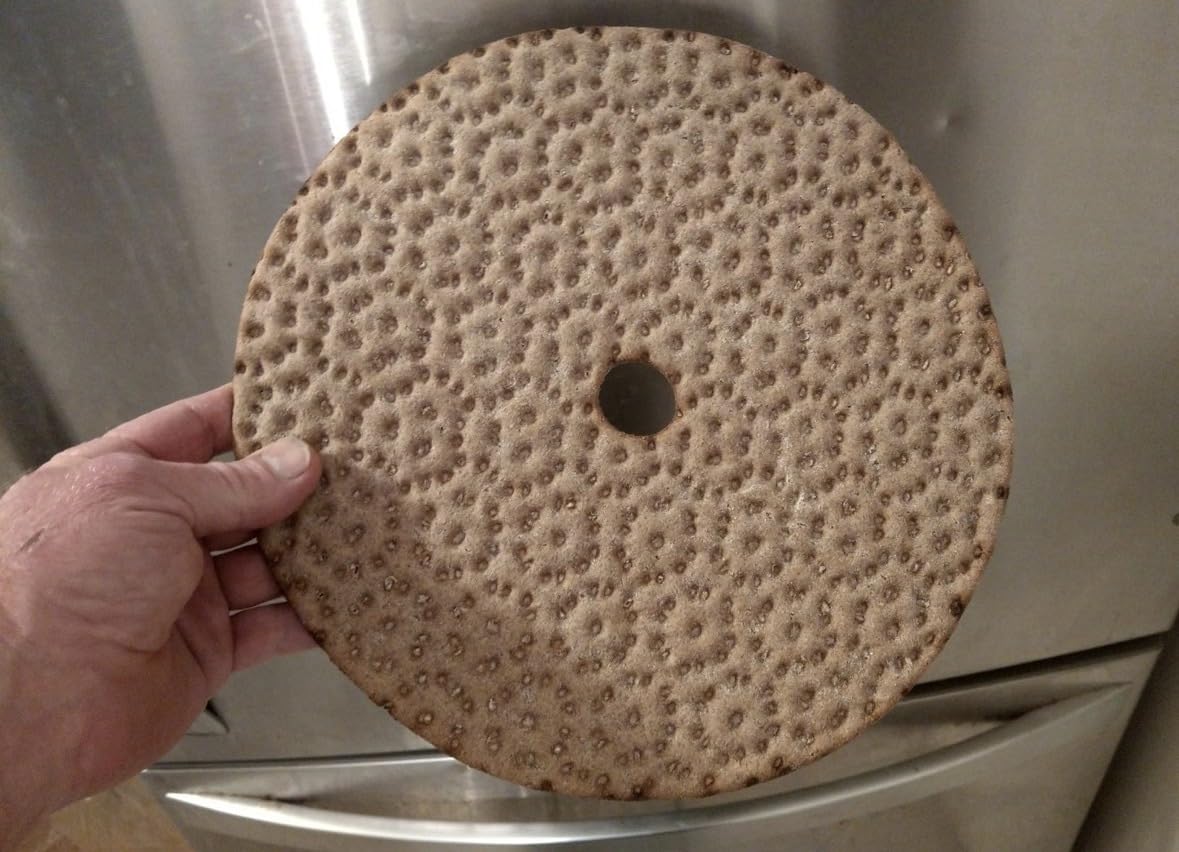 Finn Crisp Siljans Round Rye Crispbread wheel on a salad plate for quick meal.