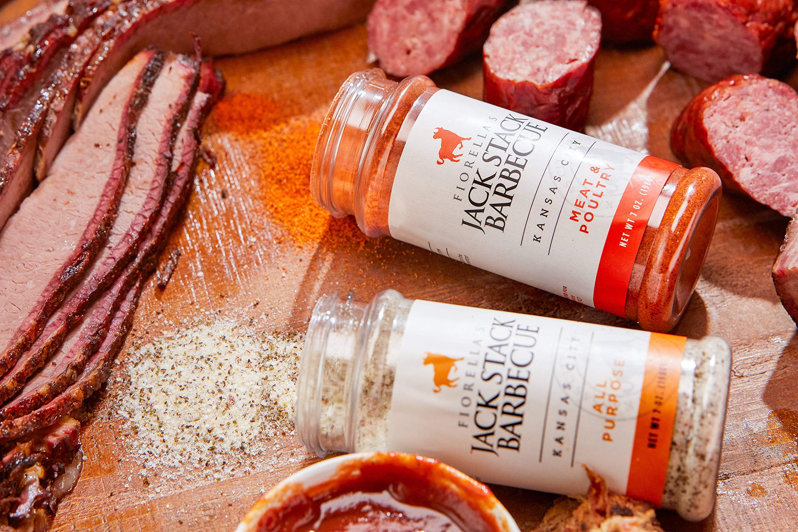 Fiorella's Jack Stack Dry Rub on chicken during grilling for savory bite.