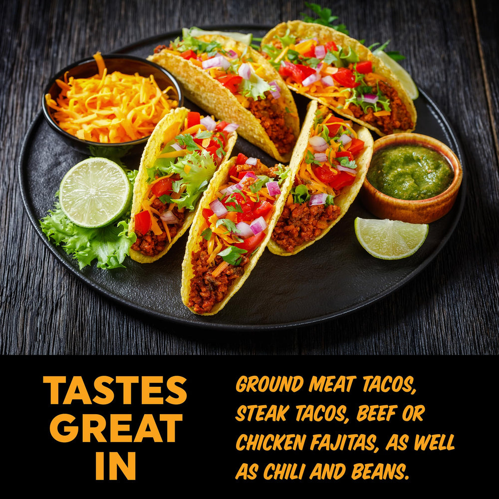 Fajitas sizzling with Fire & Smoke Society taco seasoning in a hot skillet.
