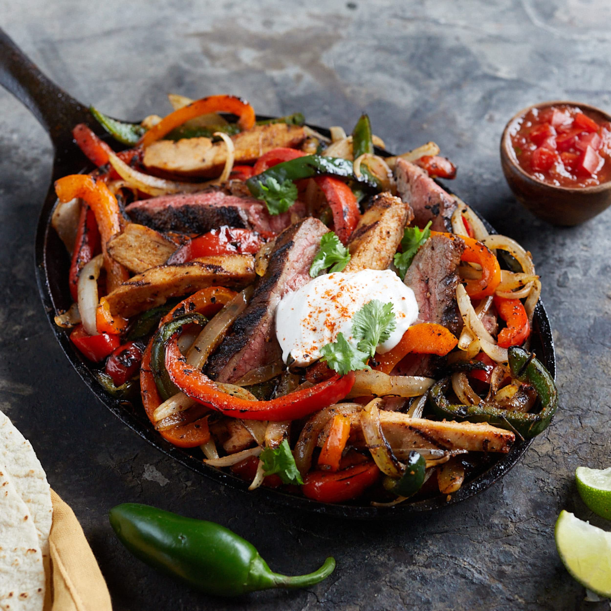 Tacos plated with fresh toppings showing versatile seasoning use.