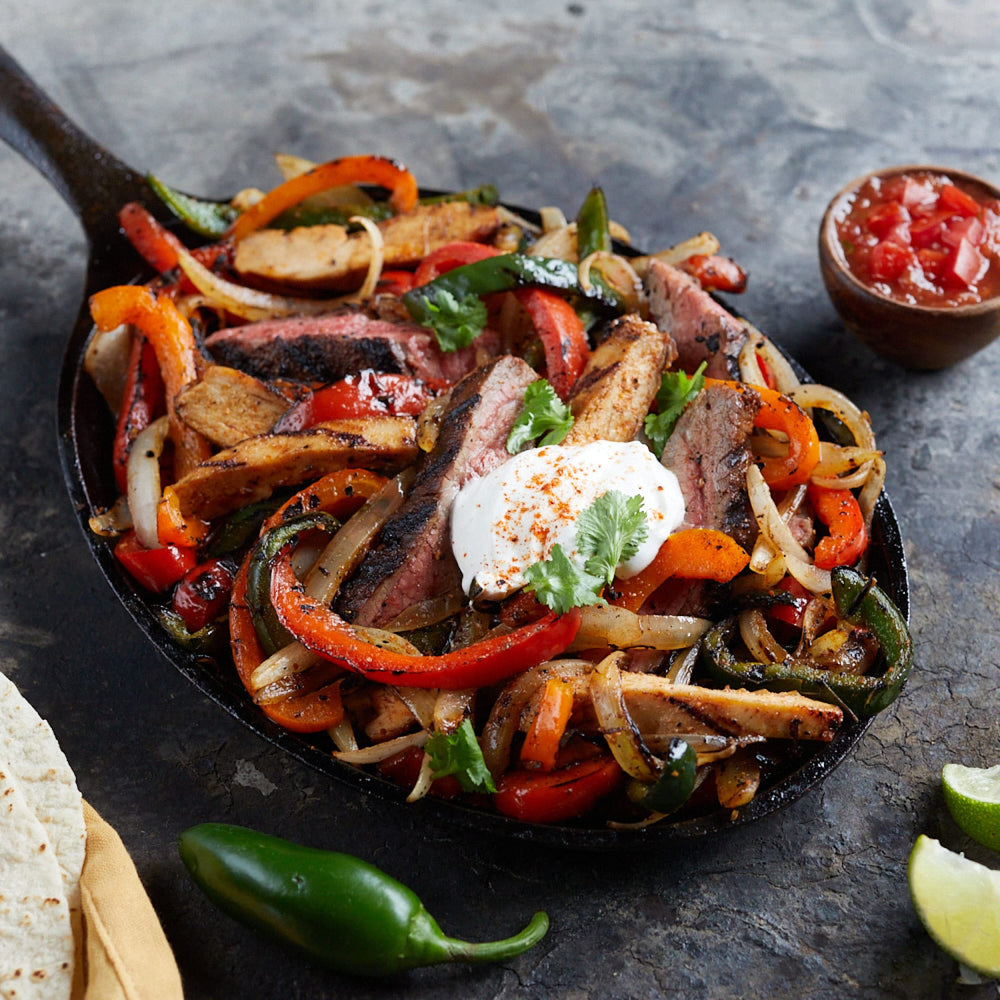 Tacos plated with fresh toppings showing versatile seasoning use.