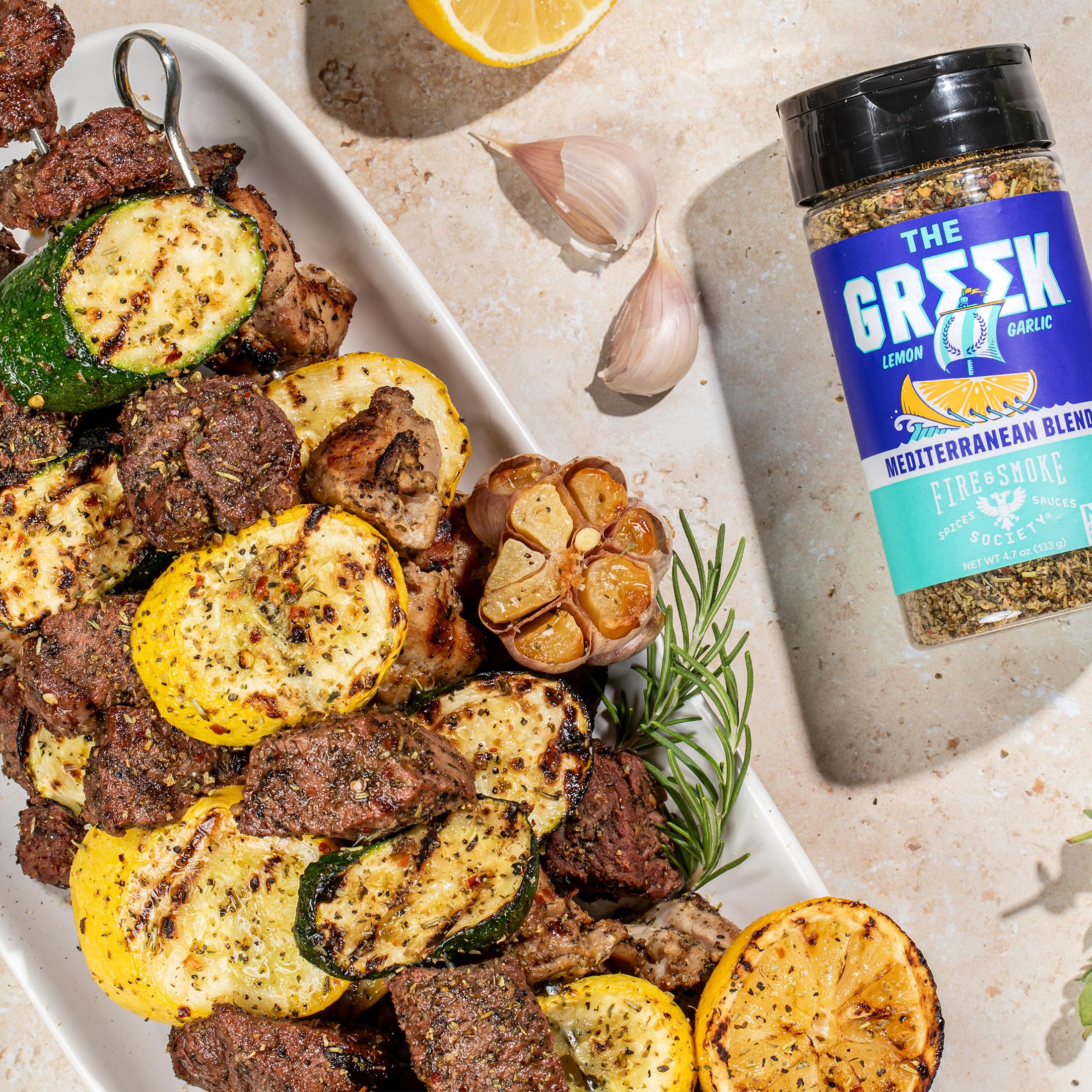 Fire & Smoke Society Greek seasoning on lamb chops before grilling.