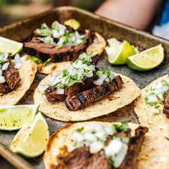 Fire & Smoke Society grilled skirt steak ready for a bold, flavorful finish.
