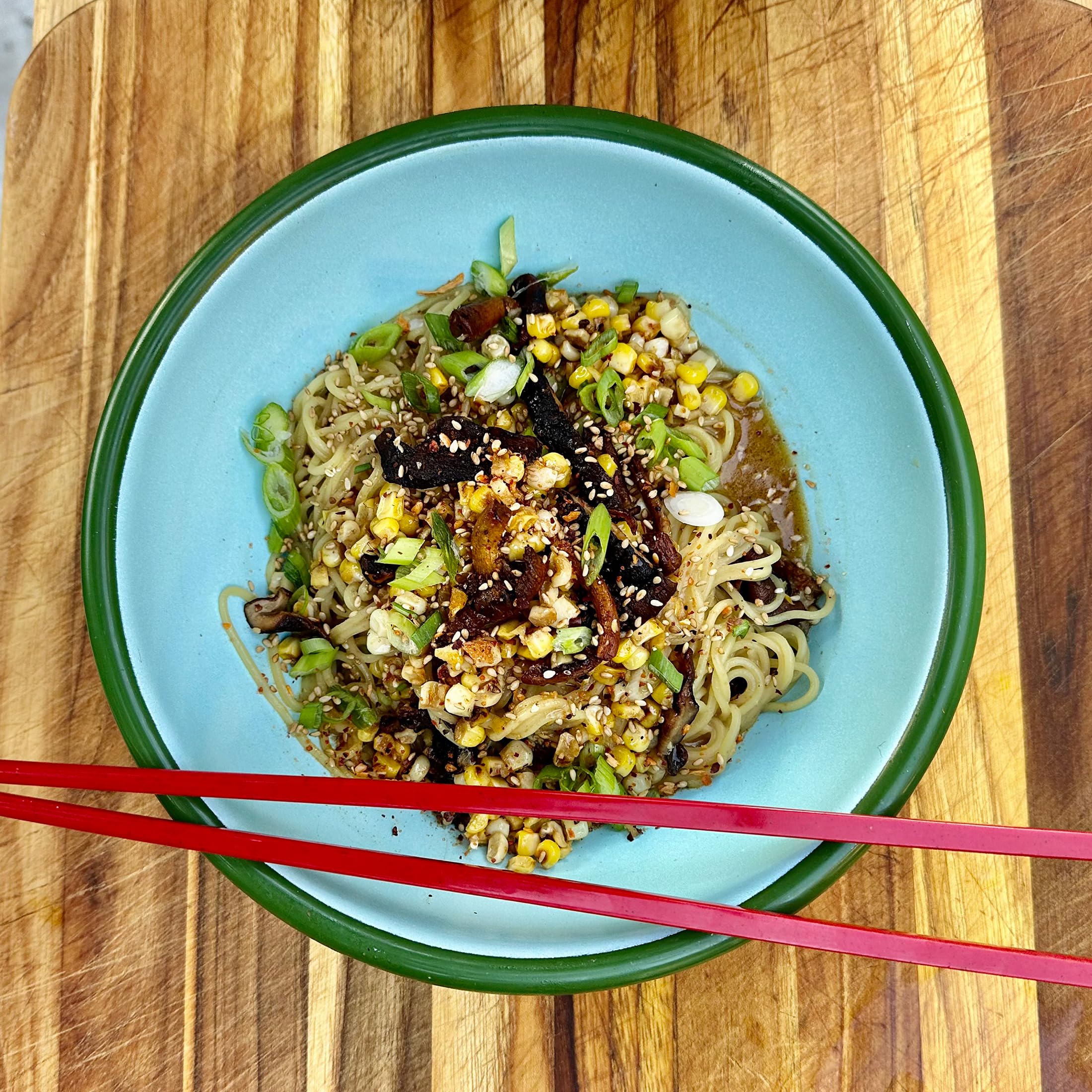 Fire & Smoke Society Noodle House stir-fry kitchen demo shows vibrant seasoning in action.
