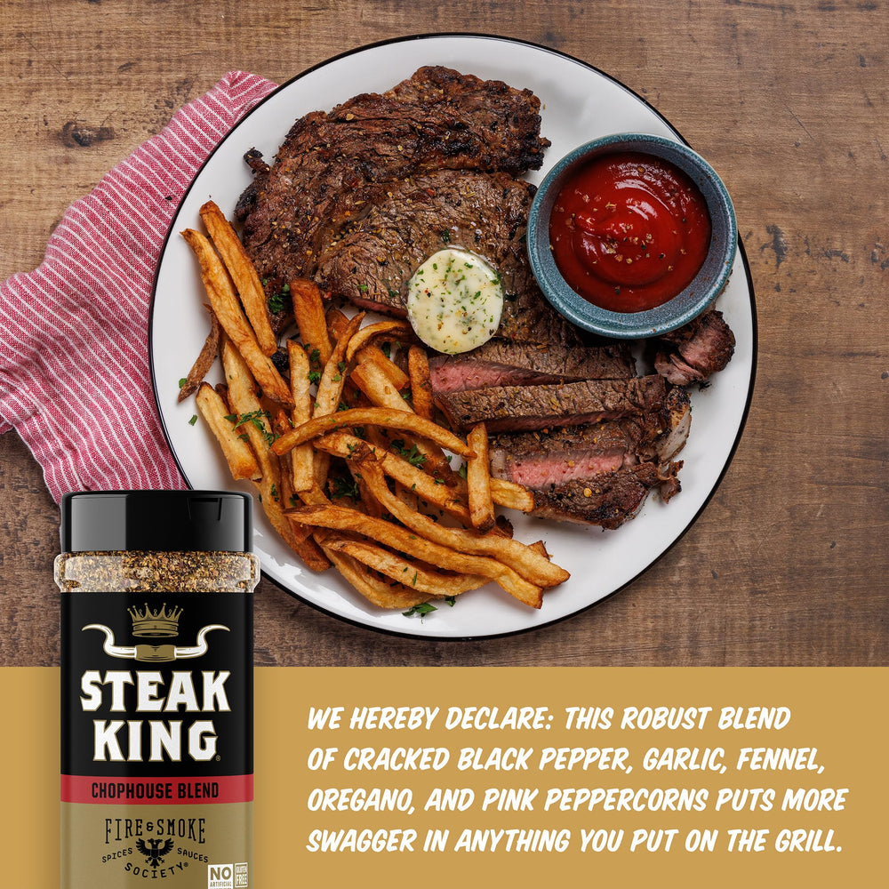 Fire & Smoke Society Steak King bottle on grill-ready beef steaks for rich crust