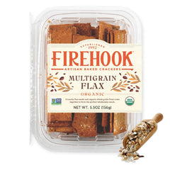 Firehook Multigrain Flax Crackers on a cheese board, perfect for entertaining.