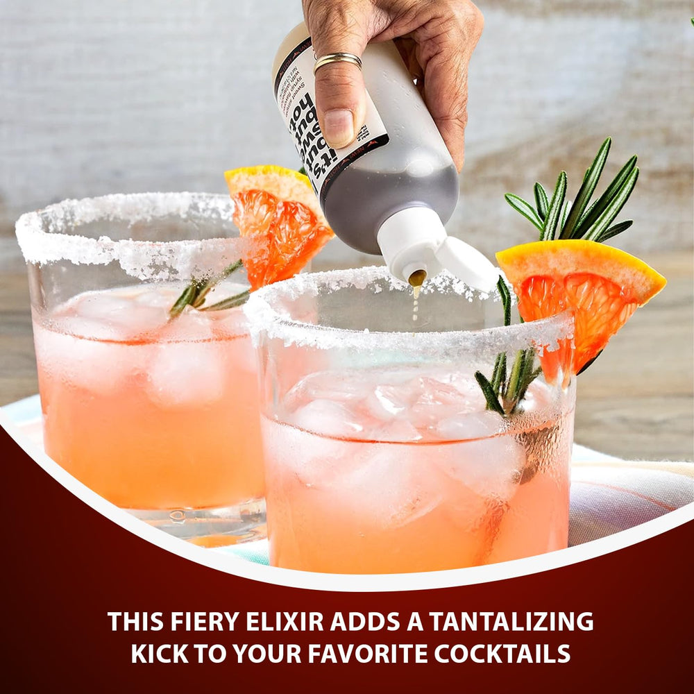 Fire Syrup with cocktail glass, garnish-ready for spicy drinks.