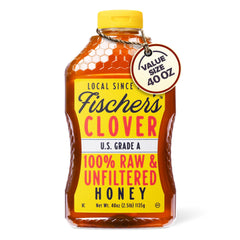 Fischer's Clover Honey being poured from a bottle, ideal natural sweetener for tea.