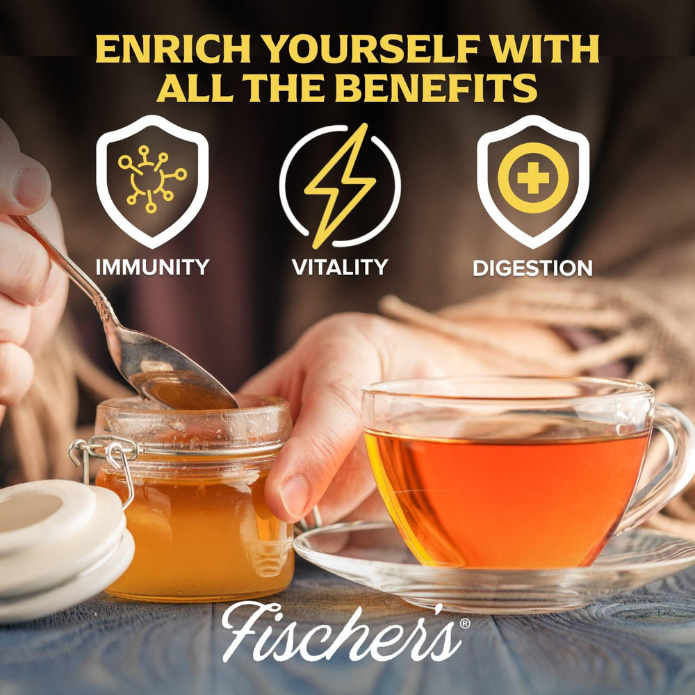 Pouring Fischer's honey into tea demonstrates versatile use as a natural sweetener.