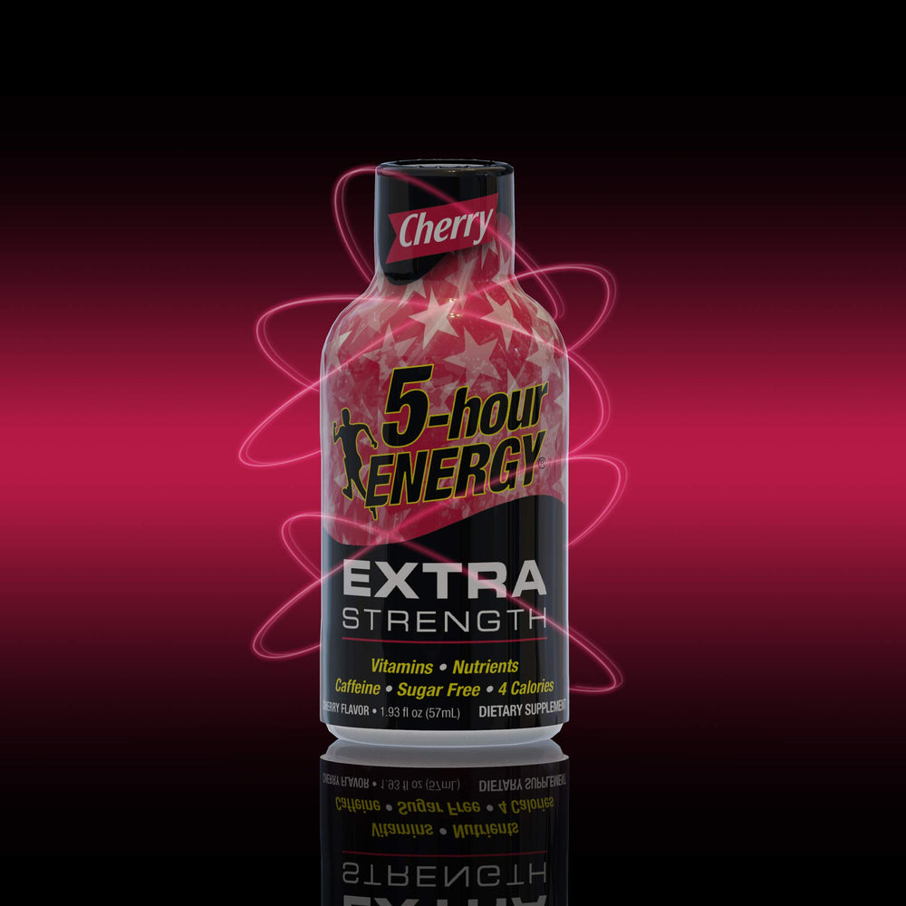 Pouring a 5-hour ENERGY Extra Strength Cherry flavor shot for fast alertness during busy work hours