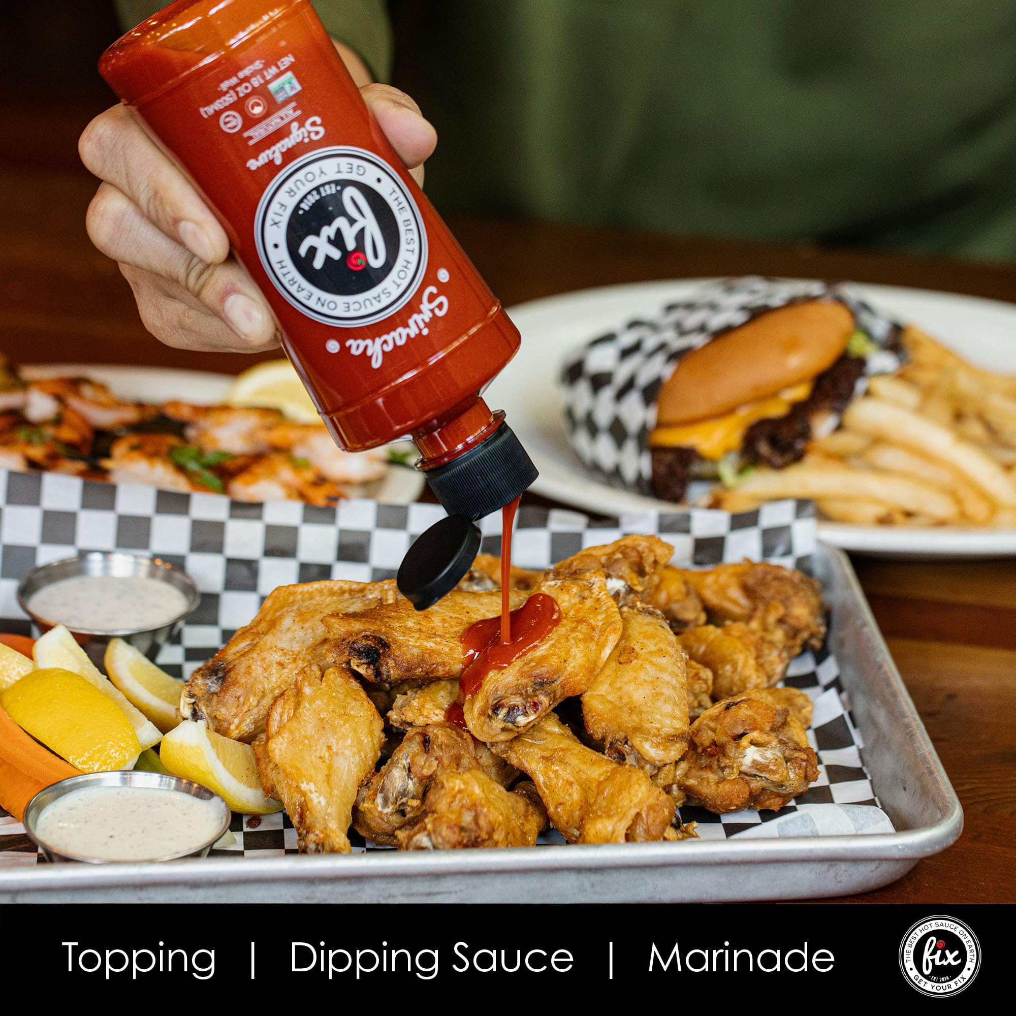 Fix Hot Sauce Sriracha bottle on table conveys premium quality.