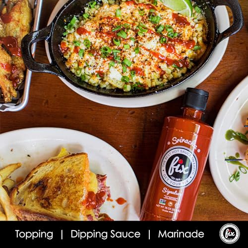 Glistening glass bottle of Fix Hot Sauce Sriracha ready to elevate meals.