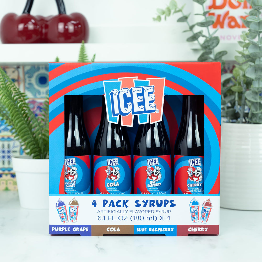 Close-up of Fizz Creations ICEE bottles in purple grape and blue raspberry flavors.