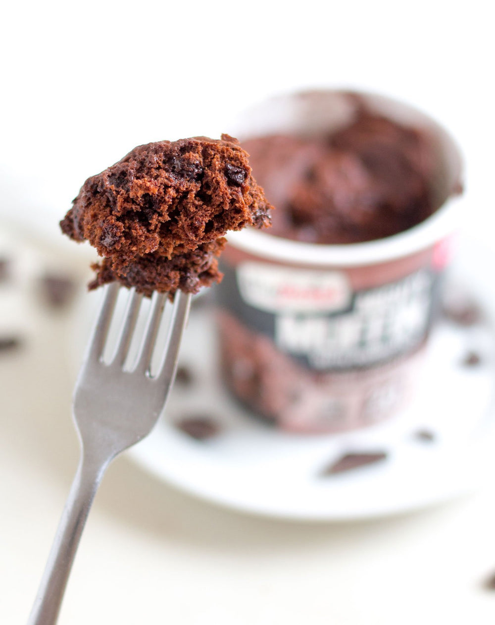 Mighty Muffins double chocolate chips close-up, indulgent post-workout treat.