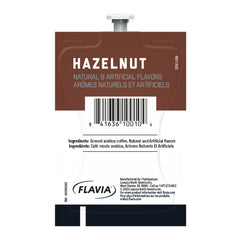 Open box of Flavia Alterra Hazelnut Freshpacks highlighting 6.5 g per pack.