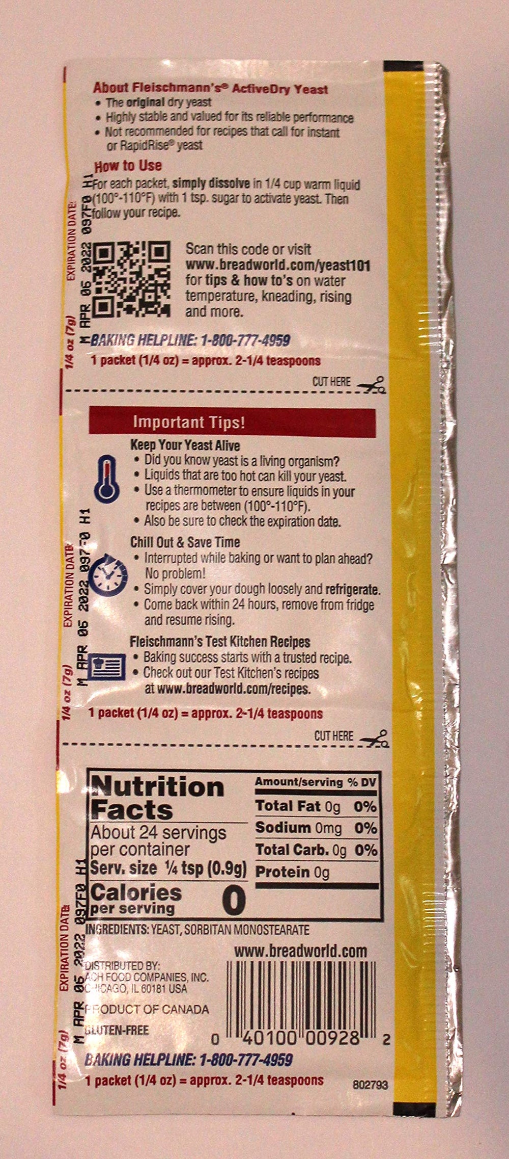 Close-up of Fleischmann's yeast strip dissolving in warm water for activation.