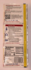 Close-up of Fleischmann's yeast strip dissolving in warm water for activation.