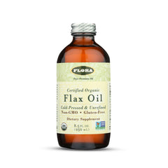 Flora flax oil bottle pour demonstrates smooth, cold-pressed omega-3 and omega-6 for daily nutrition