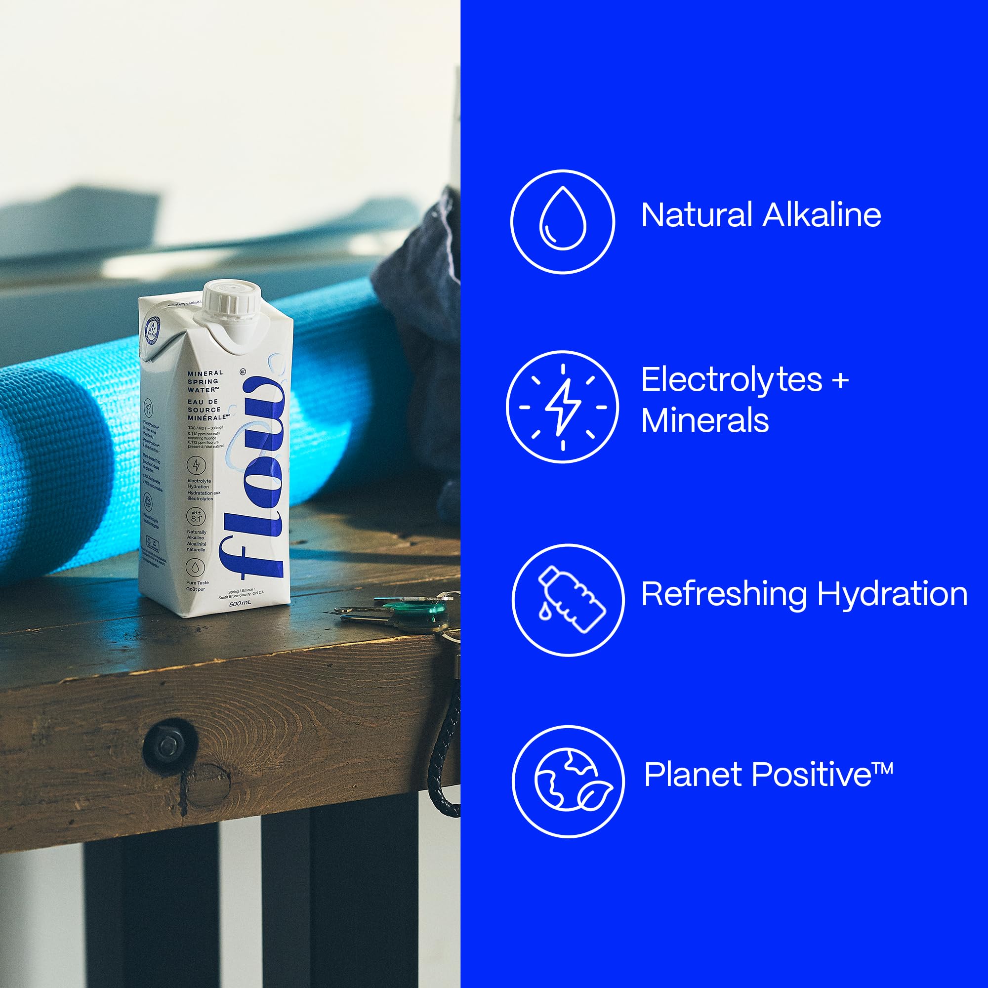 Flow Alkaline Spring Water on table ready for hydration