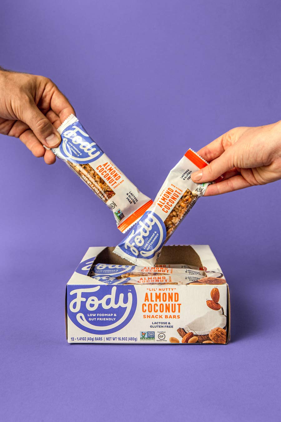 Fody Almond Coconut Snack Bars on-the-go for quick protein and energy.