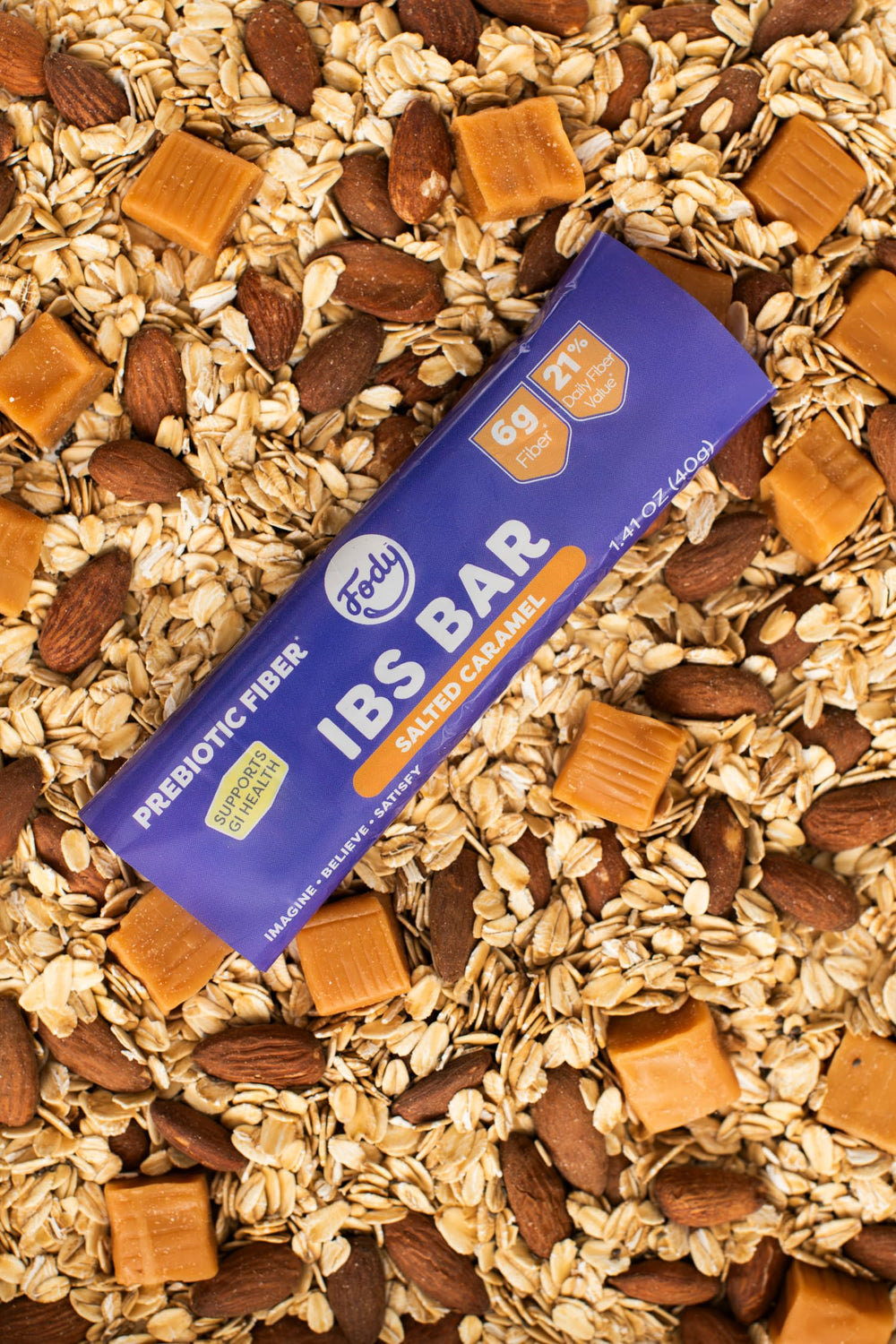 Fody Salted Caramel IBS Snack Bars ingredients close-up with dates, almonds, pecans