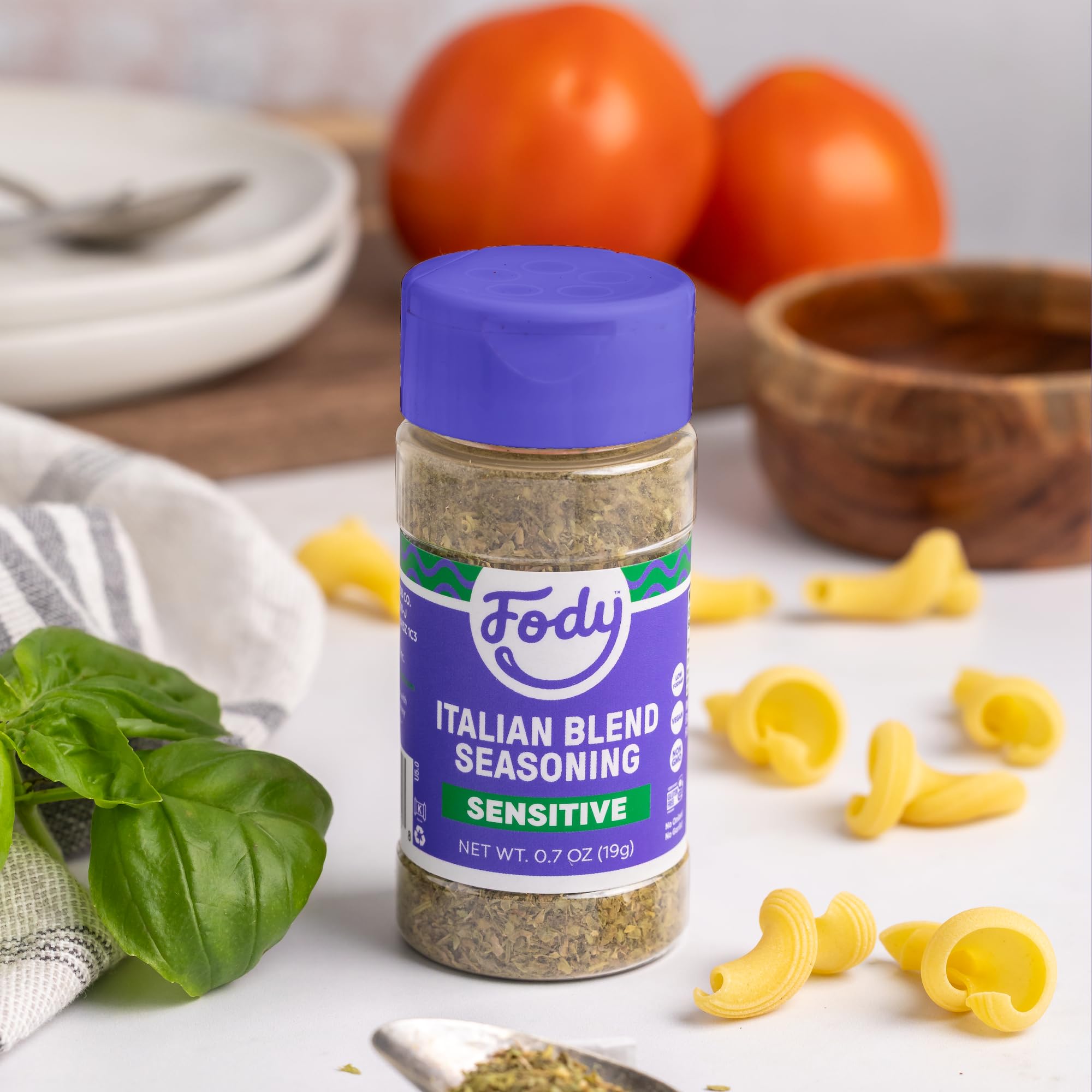Fody Italian Blend Seasoning bottle in a kitchen setup with evidence of keto and vegan notes