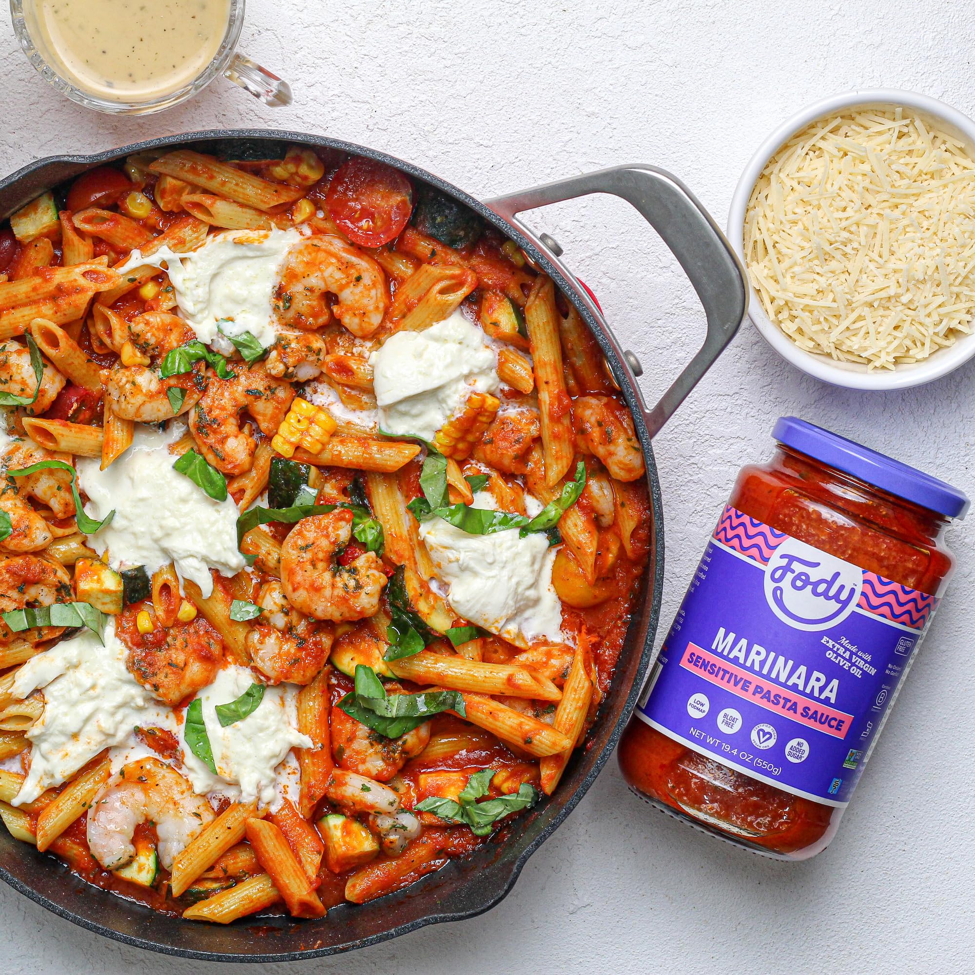 Fody Marinara jar with spoon ready for quick pasta preparation.