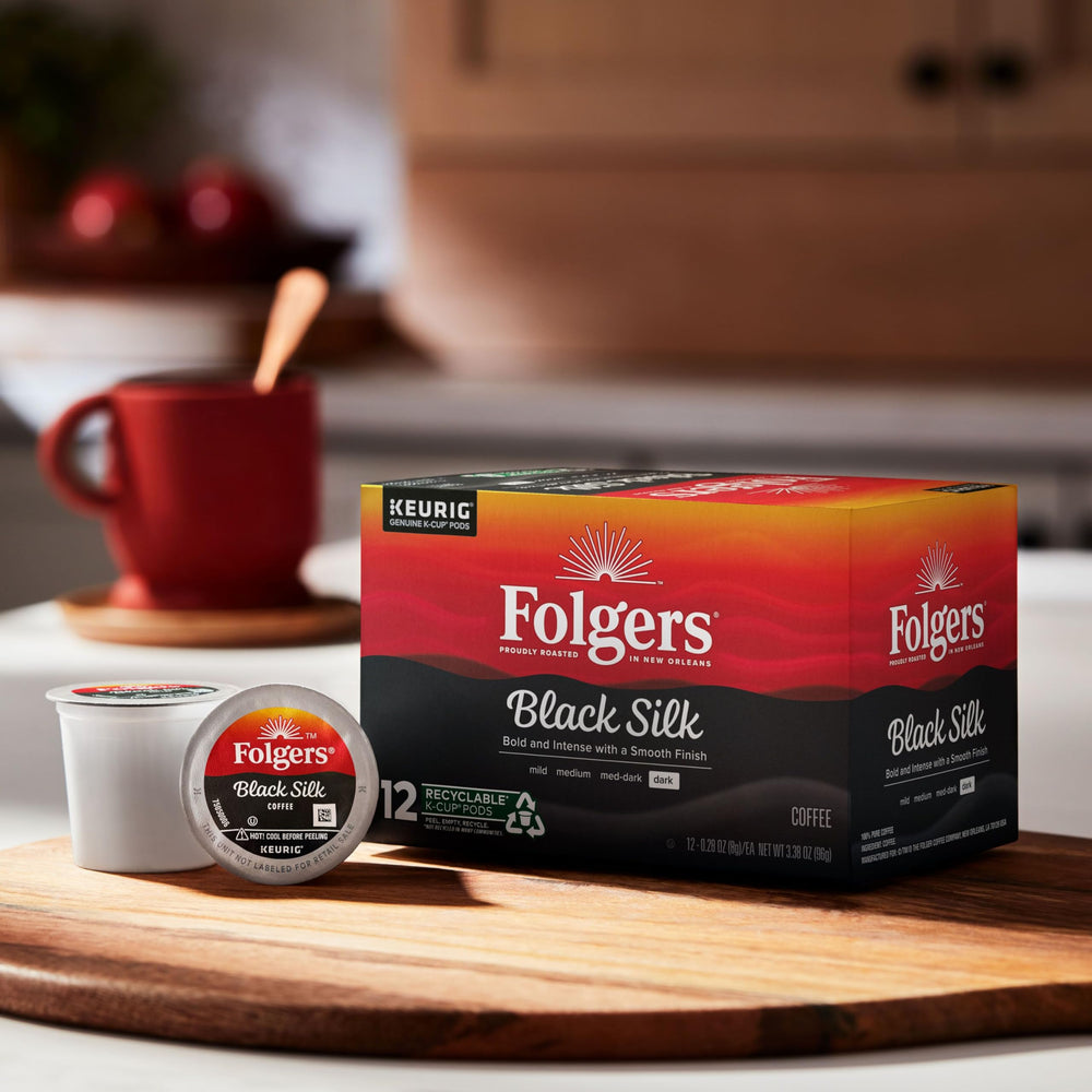 Close-up of Folgers Black Silk beans showing deep roast.