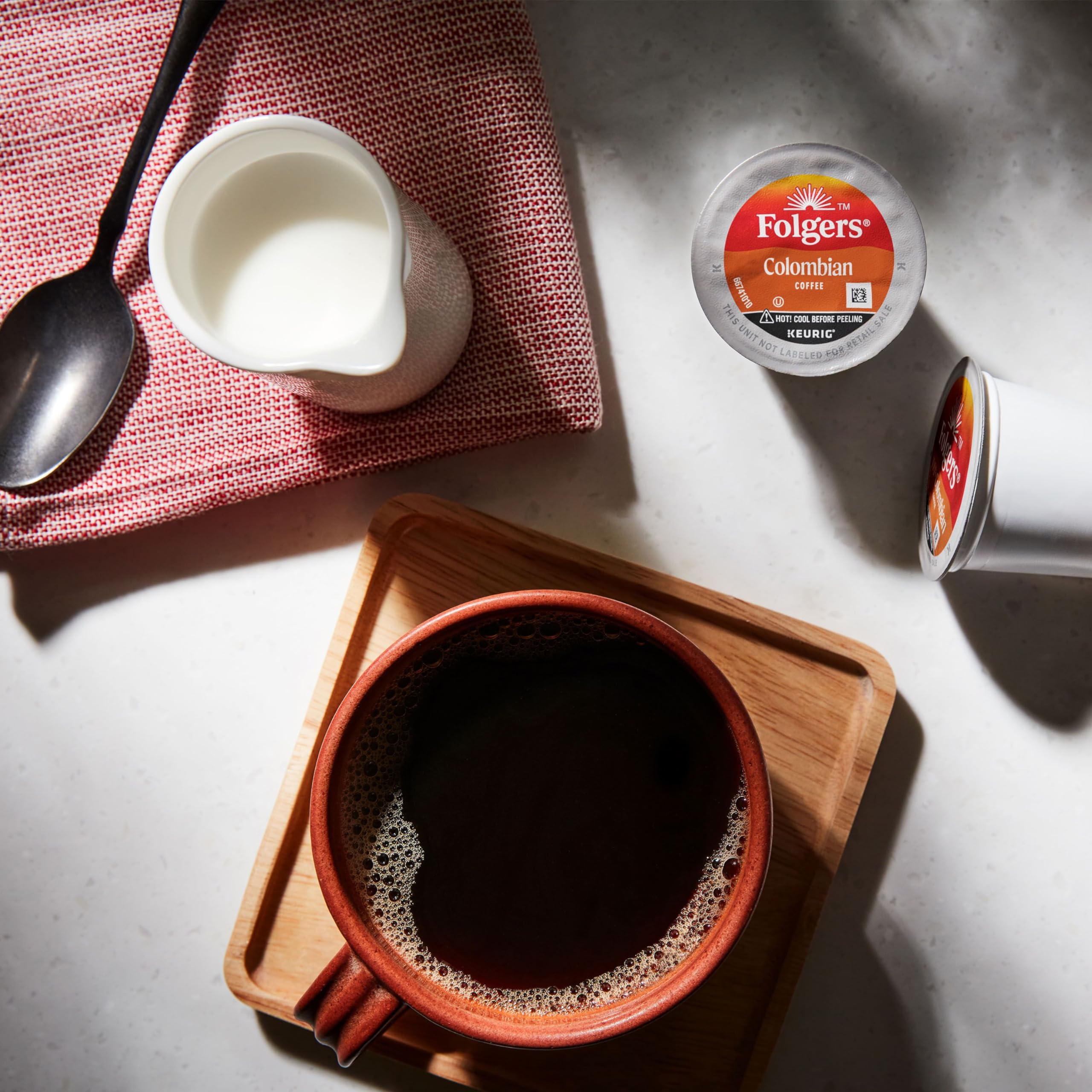 Brewing Folgers Colombian Medium Roast with a Keurig button for convenience.