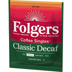 Hot water pours as Folgers decaf single bag brews a fresh cup.