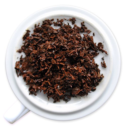 Fortnum & Mason loose tea leaves in a measuring spoon, ready for a fresh cup.