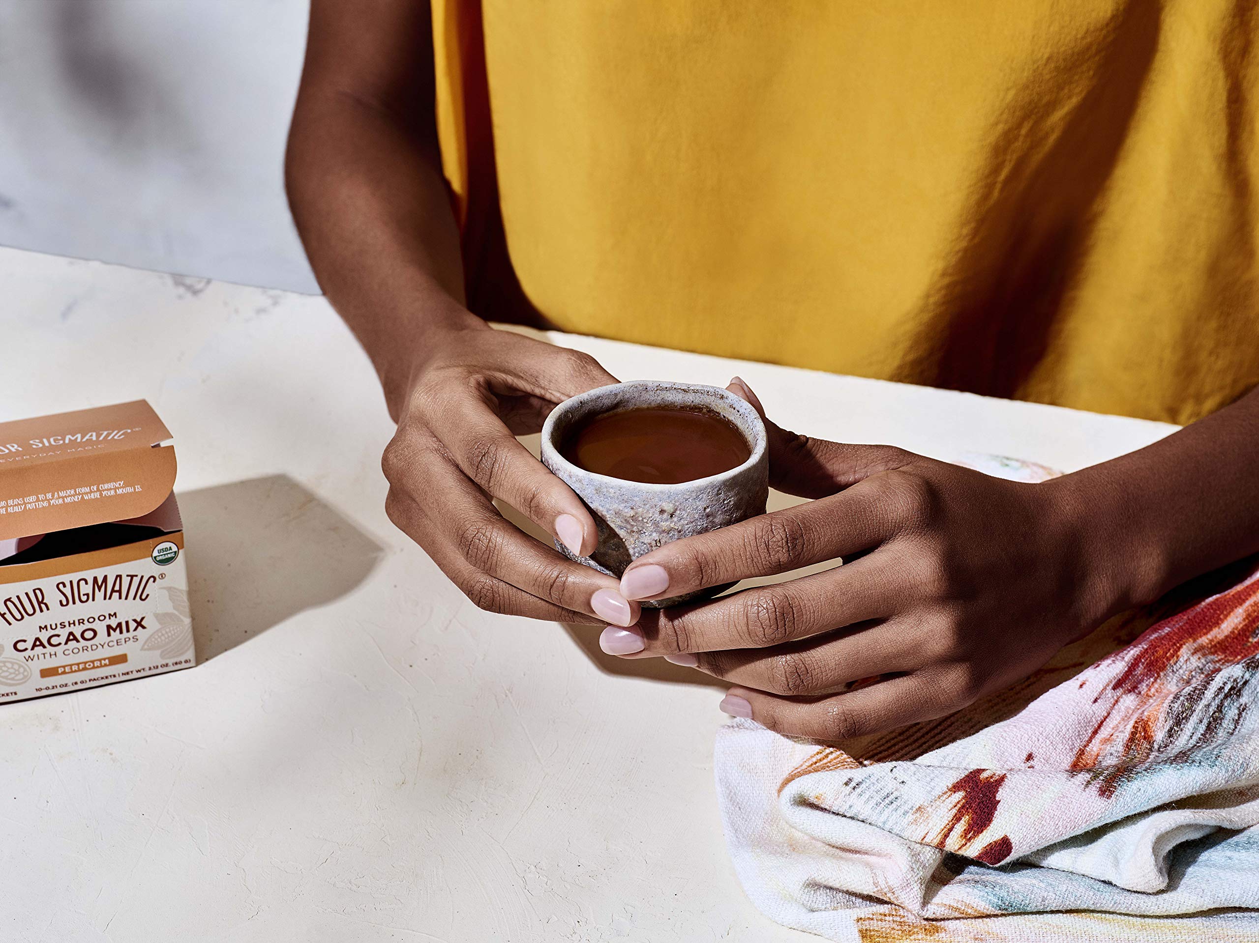 Four Sigmatic Boost Mushroom Cacao ginger swirl in cup, inviting scent.