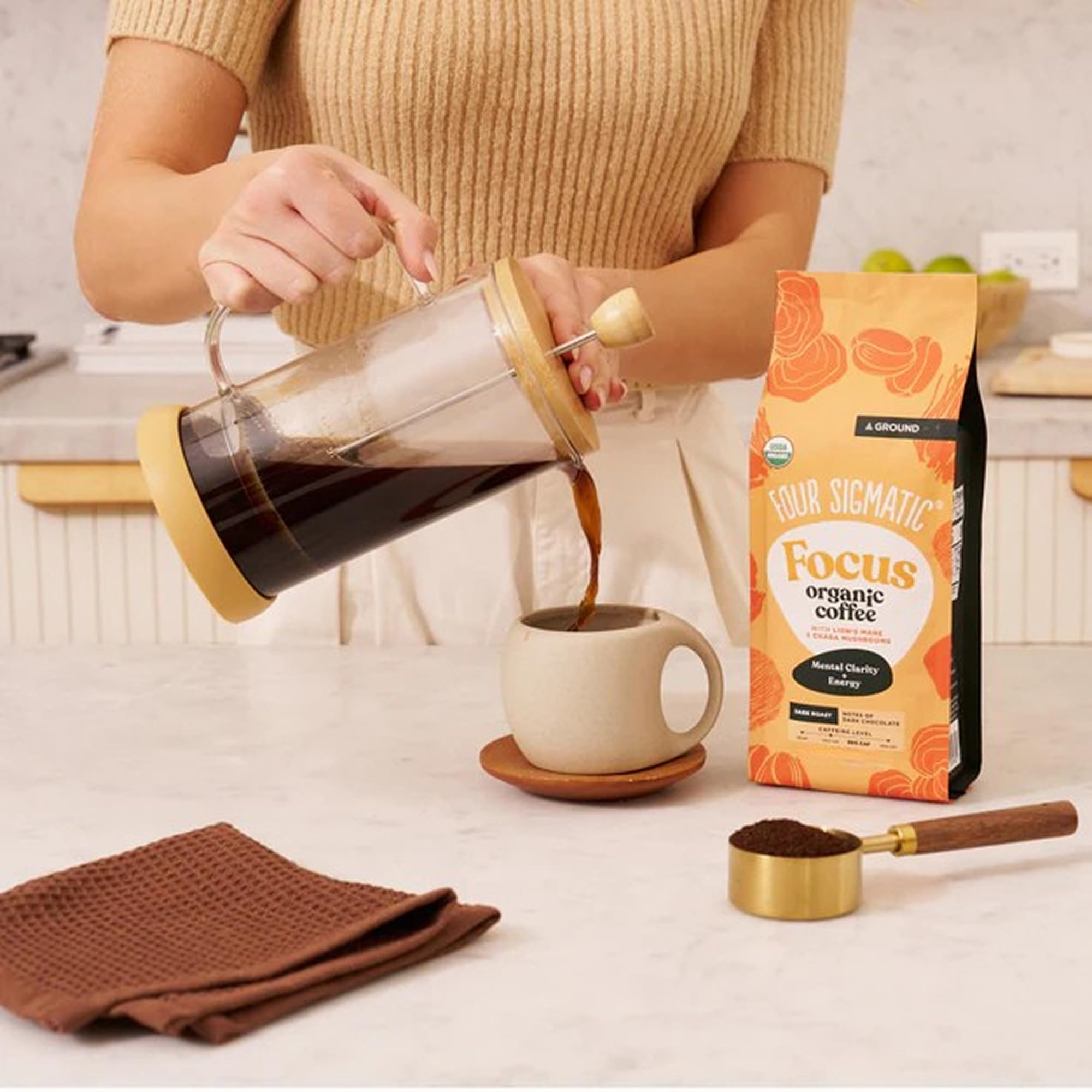 Four Sigmatic Lion's Mane Ground Coffee bag label showing organic and fair trade options.