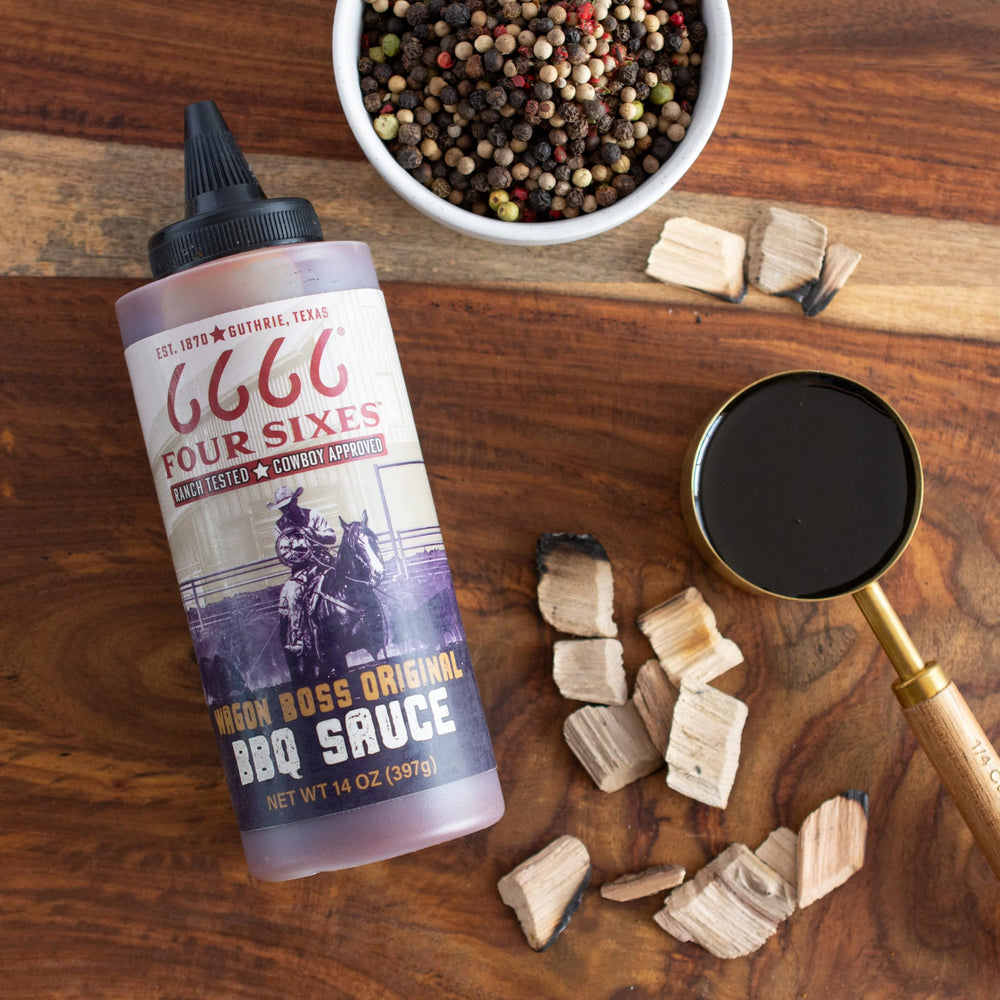 FOUR SIXES Wagon Boss sauce glaze streak on grilled steak for smoky sweetness.