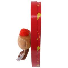 Close-up of vibrant fruity gummy hot dogs inside the heart box.
