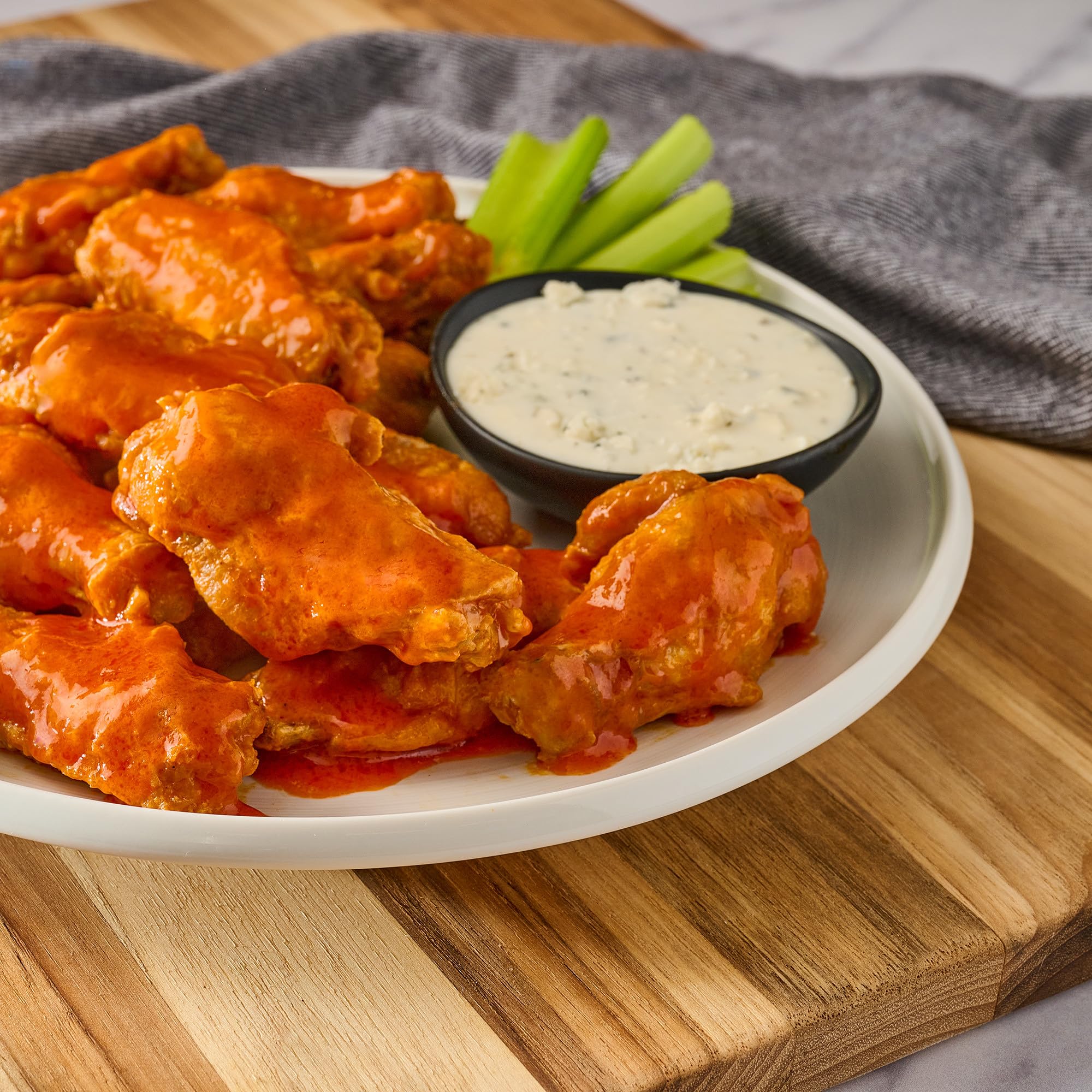 Franks RedHot Buffalo Wings Sauce wings on plate showcase restaurant-quality spice