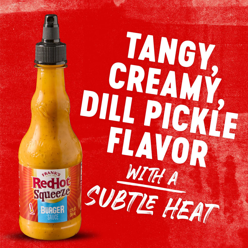 Fries dipped in Frank's RedHot Burger Sauce for zesty flavor