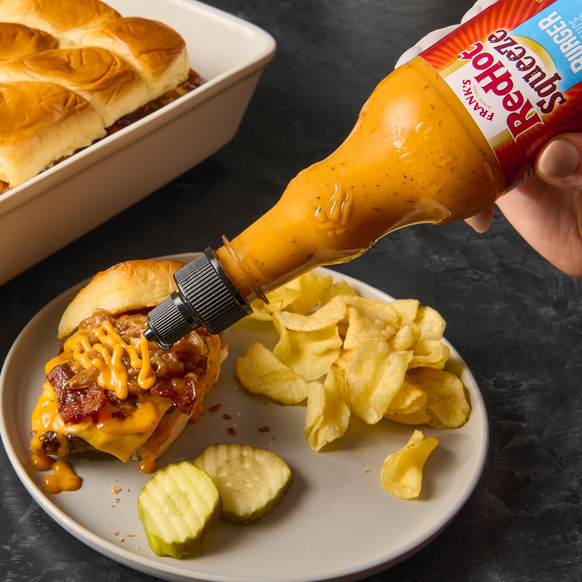 Pizza topped with a drizzle of Frank's RedHot Burger Sauce