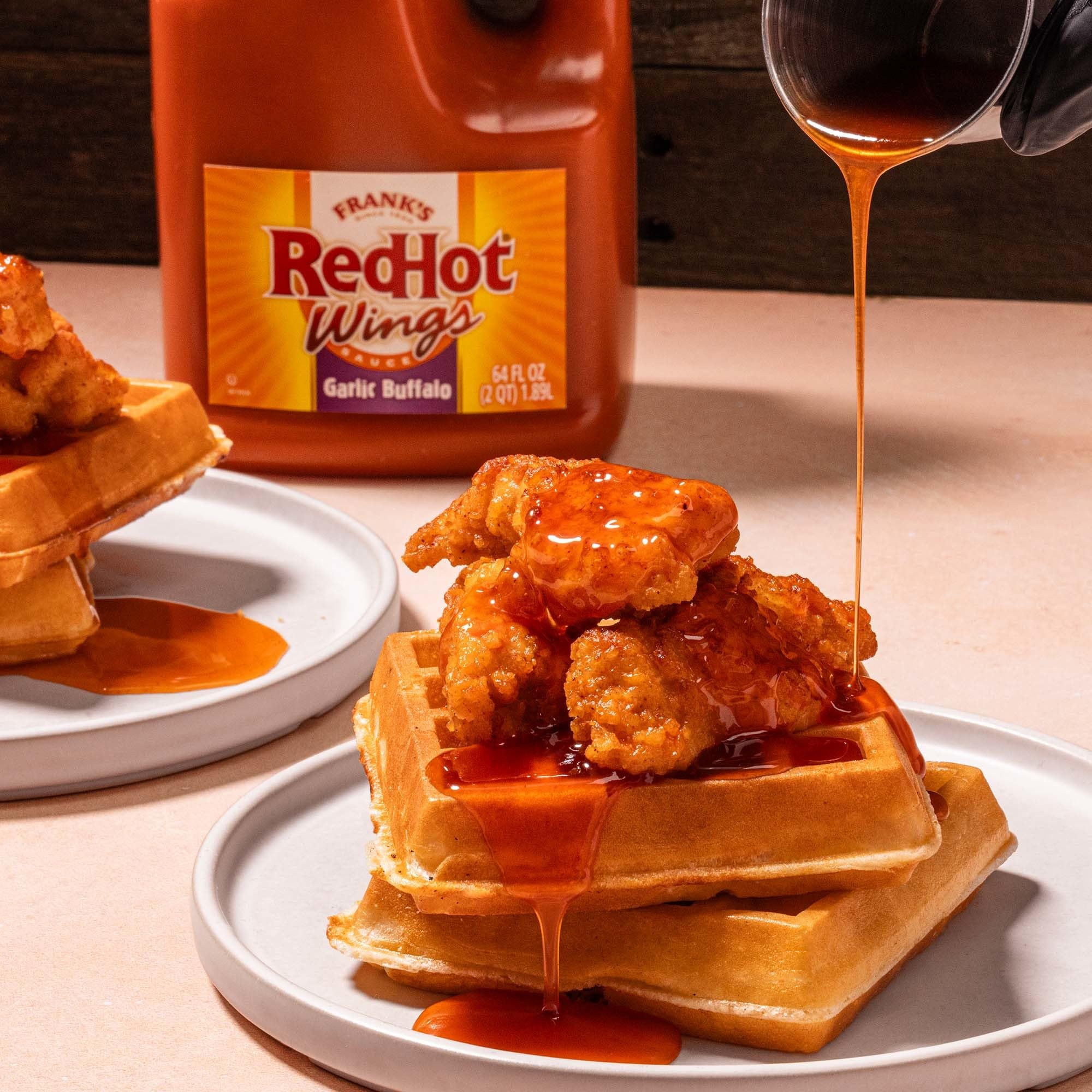 Franks RedHot Garlic Buffalo Wings Sauce table-service—easy ladling for bar bites.
