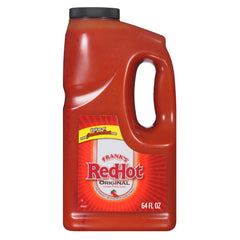 Franks RedHot Original bottle pour—bold heat enhances wings.